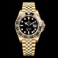GMT dorado — Esfera negra y brazalete de cinco filas