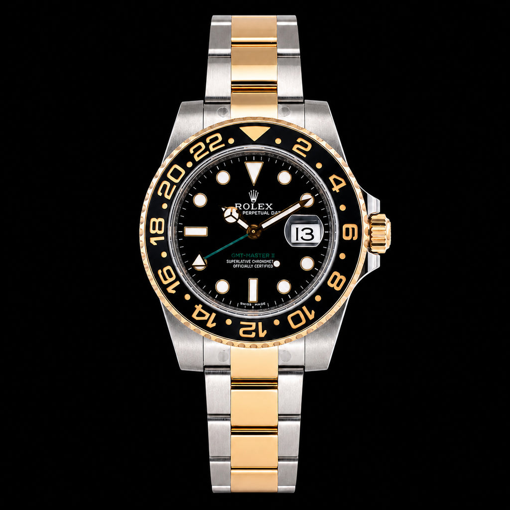 GMT bicolor — Bisel negro y detalles dorados