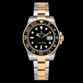 GMT bicolor — Bisel negro y detalles dorados