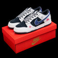 Dunk Low en blanco y negro con detalles azules