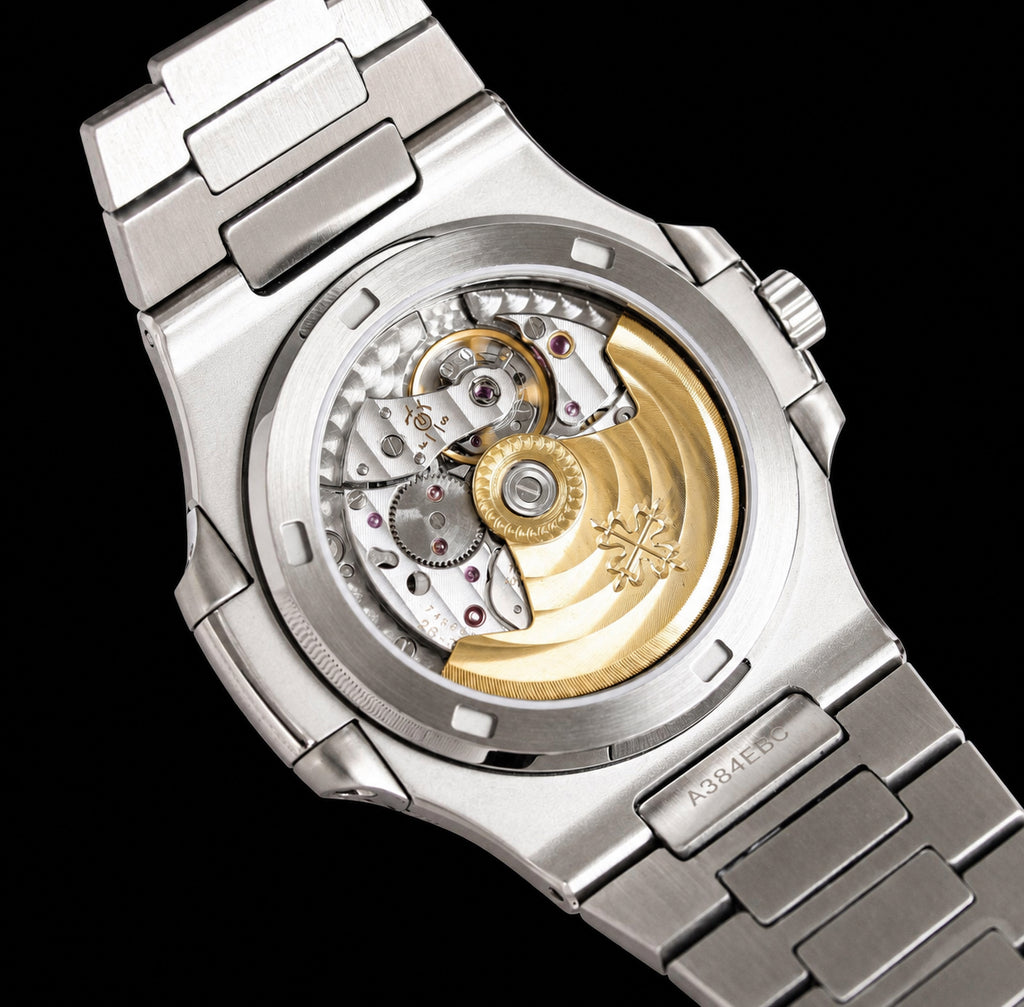 Nautilus plateado con esfera verde
